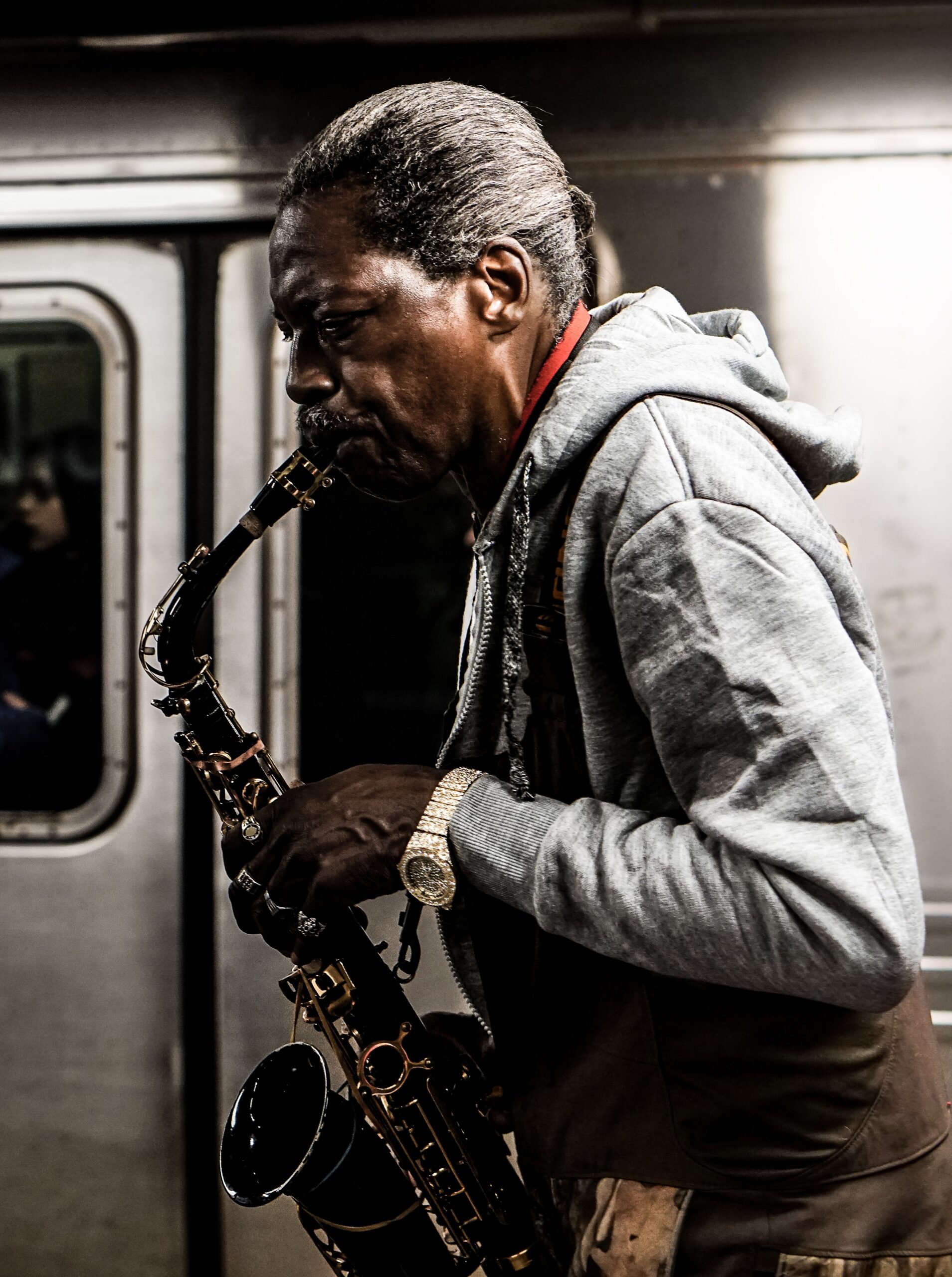 sash-margrie-hunt-Man with black Tenor Sax playing in NYC subway-unsplash