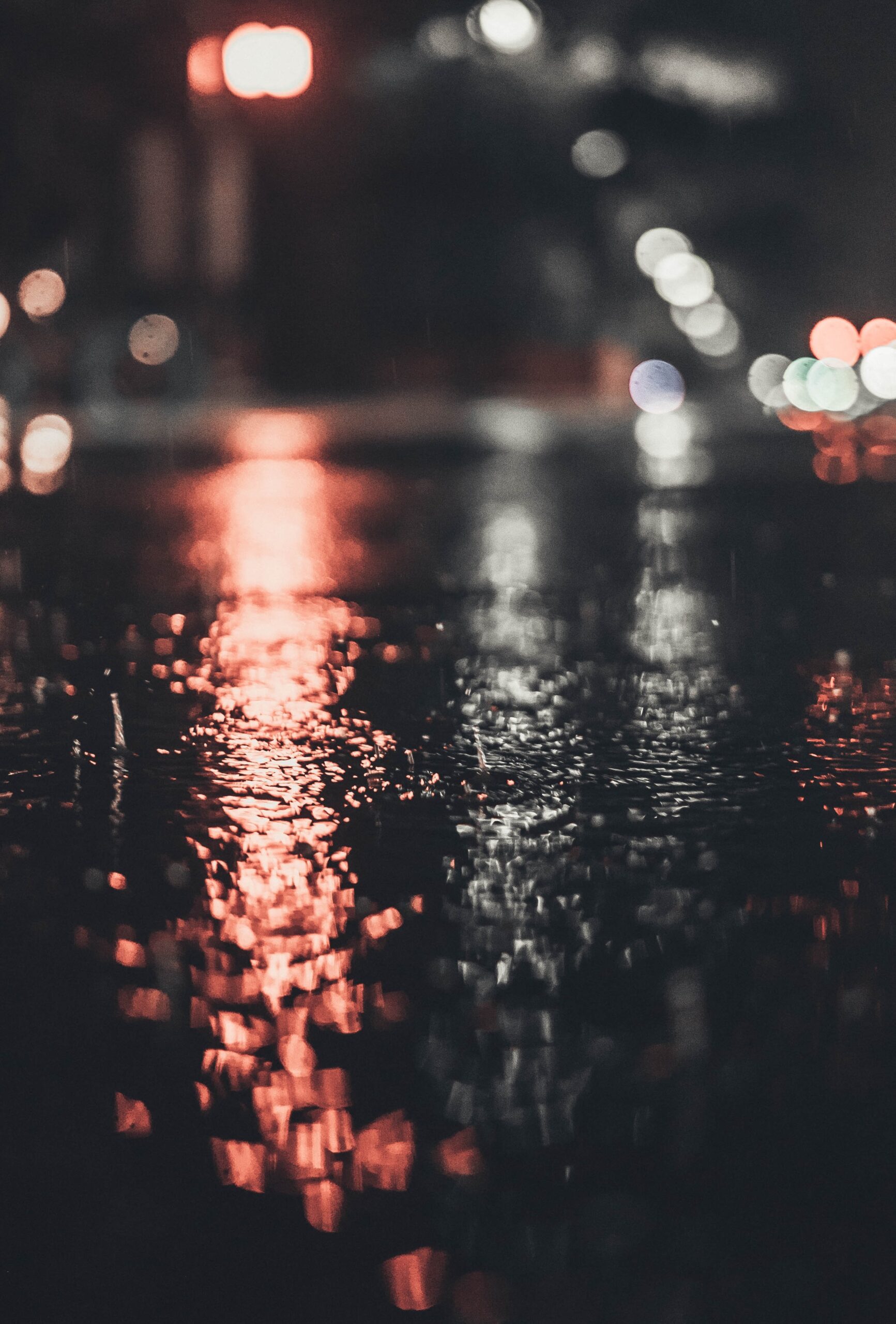 andy-grizzell-rain water splashing on street-unsplash