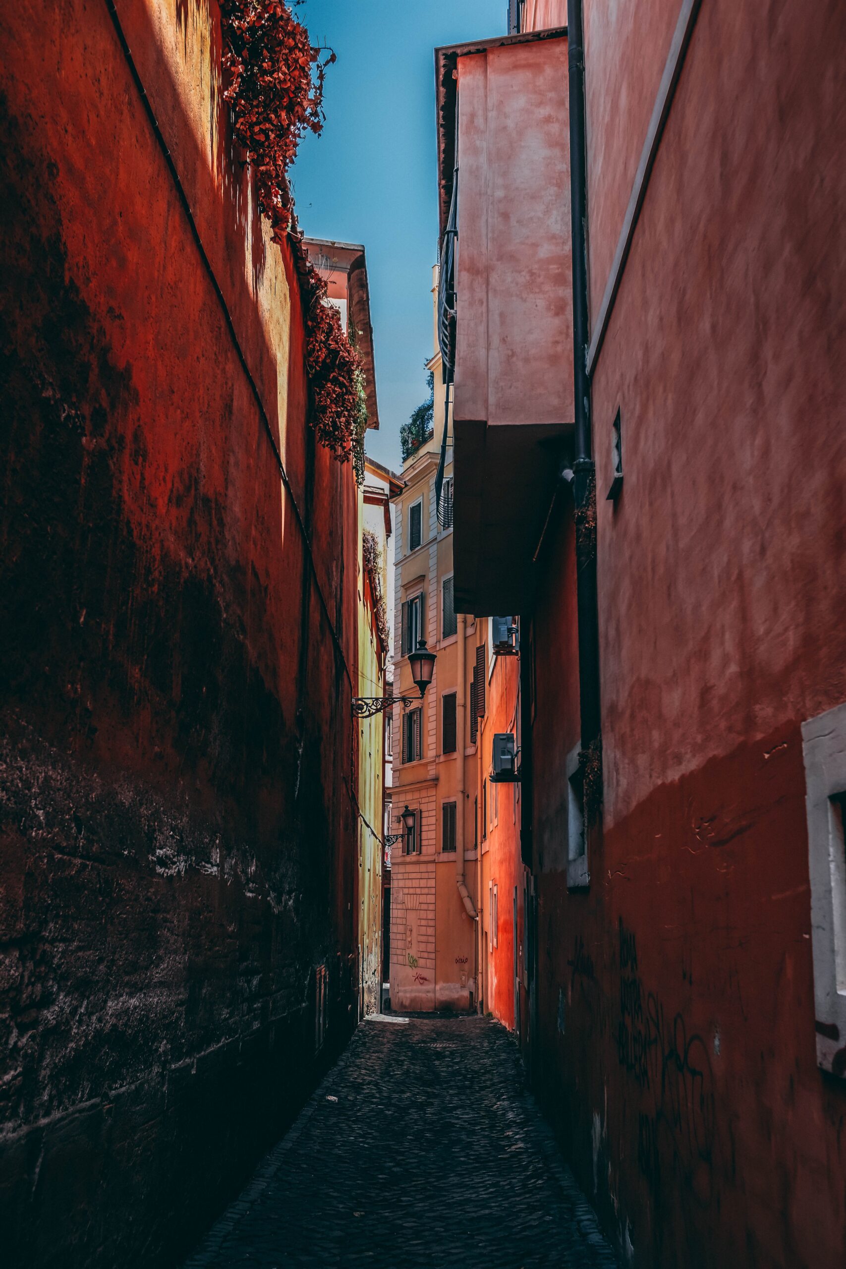 elie-guttmann-Barcelona street narrow cinnabar red alley-unsplash