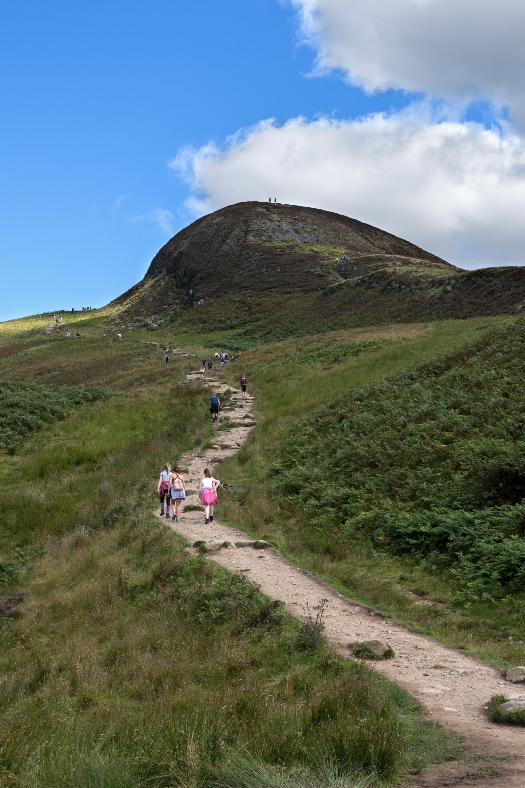 gary-ellis-Narrow hiking path up face of small mountain Scotlant awash with day hikers-unsplash