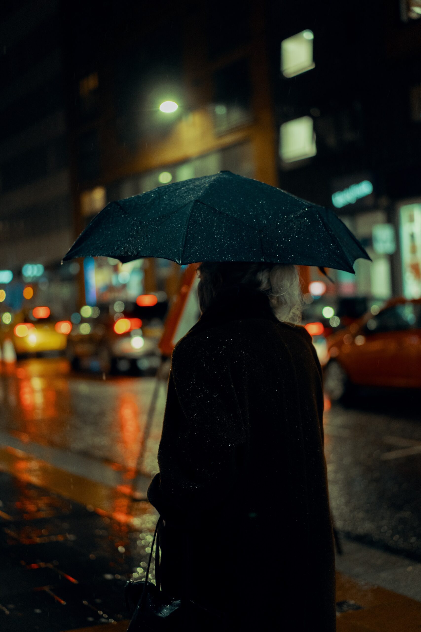 ross-sneddon-_Glasgow City rainy night man walking wet streets-unsplash