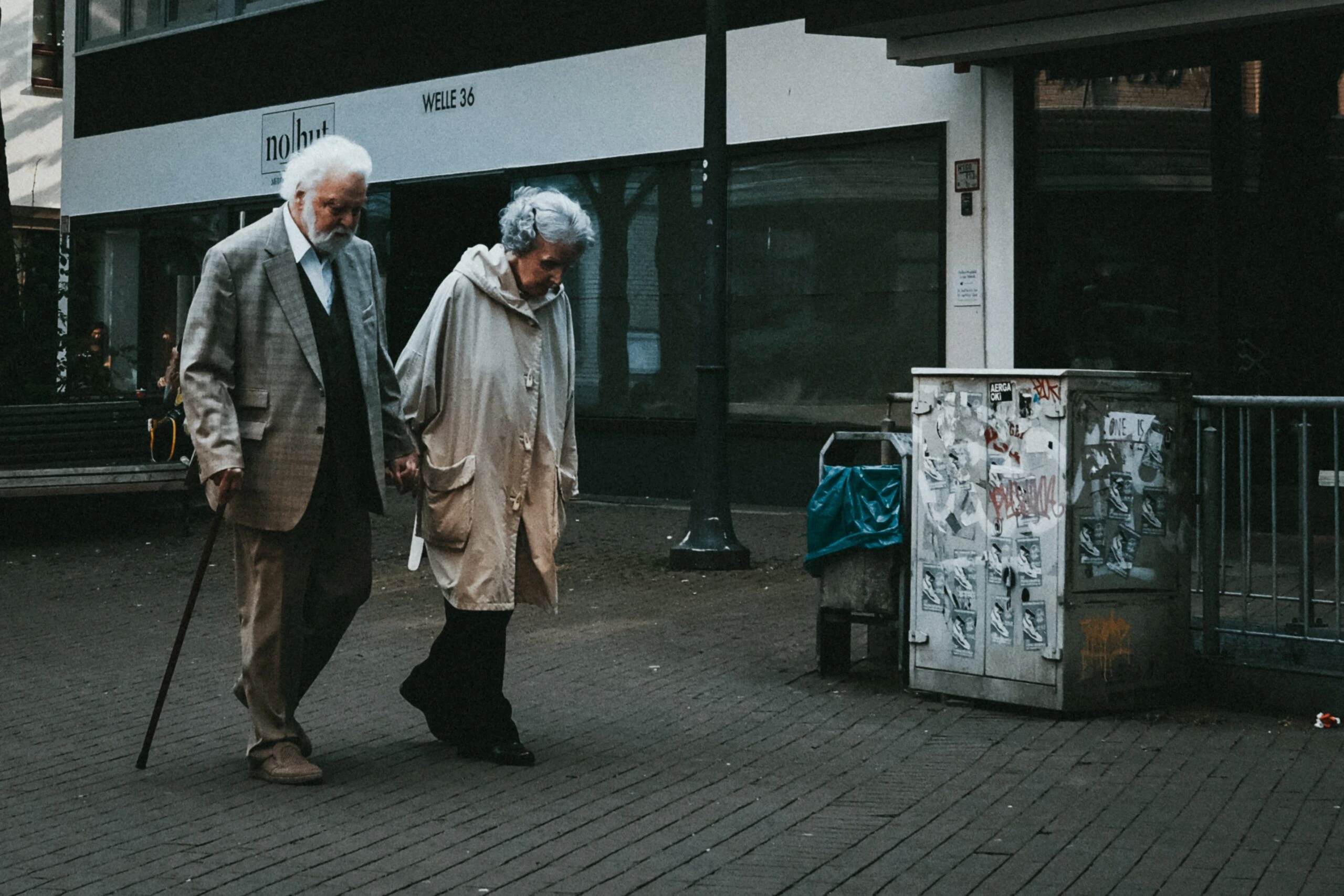 bennett-tobias-Senior couple walking hand in hand evening stroll-unsplash