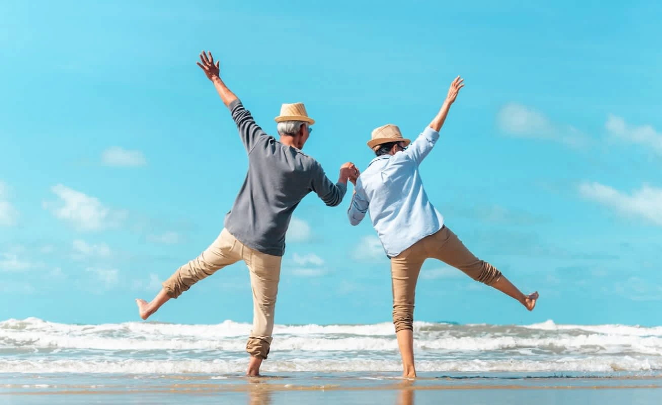 Elderly-Couple-Enjoying-Beach