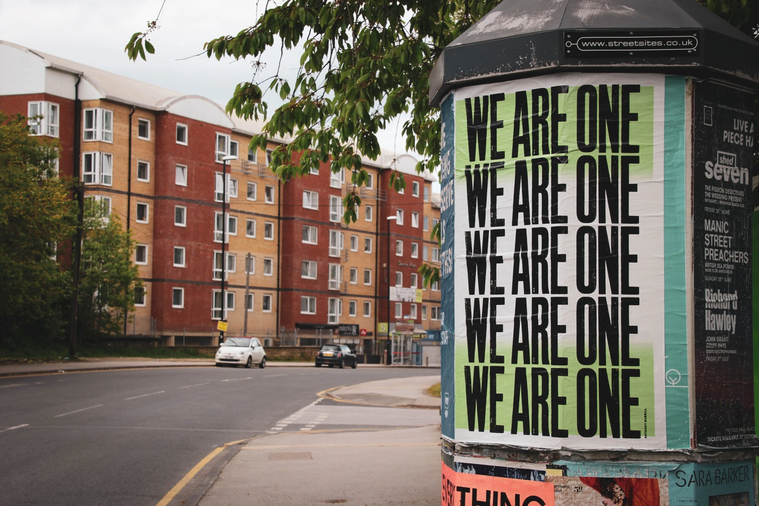 gary-butterfield-We are One flyer on bus Kiosk Leeds UK-unsplash