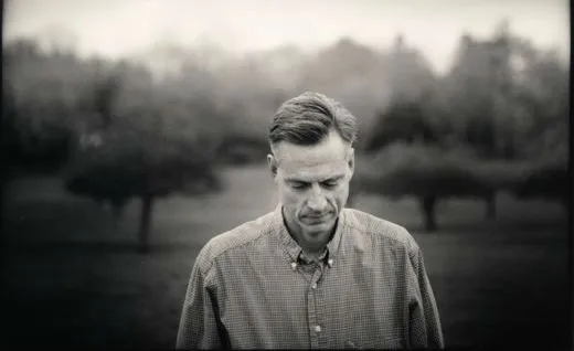 Robert Wright against a fiedl with backdrop of trees