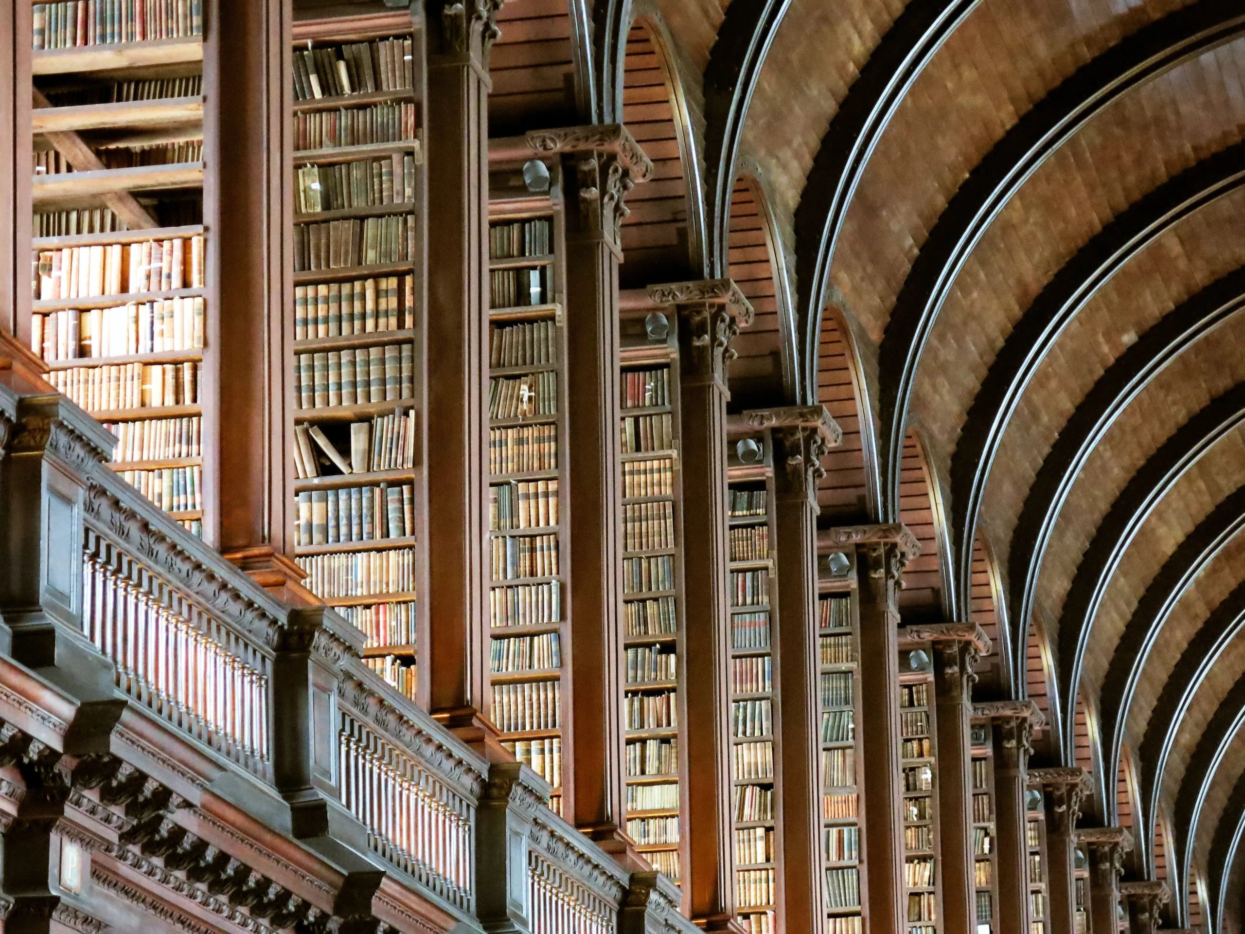 Featured in Editorial, Arts & Culture The Long Room Of The Old Library At Trinity College, Dublin, Ireland Published on July 3, 2018 Canon, PowerShot G15 Free to use under the Unsplash License The Long Room at Trinity College is one of the most beautiful libraries in the world. I took dozens of photos, but this one captured everything I love about the library: you see the old books (larger on the bottom and smaller on top), the beautiful columns standing guard in front of the shelves, and the graceful soaring of the rounded ceiling. I’m proud of this photo because they don’t allow tripods or flashes - this is the natural beauty of the room. My only wish is that we had smell-o-vision, because the smell of old books that permeates the Long Room is intoxicating.