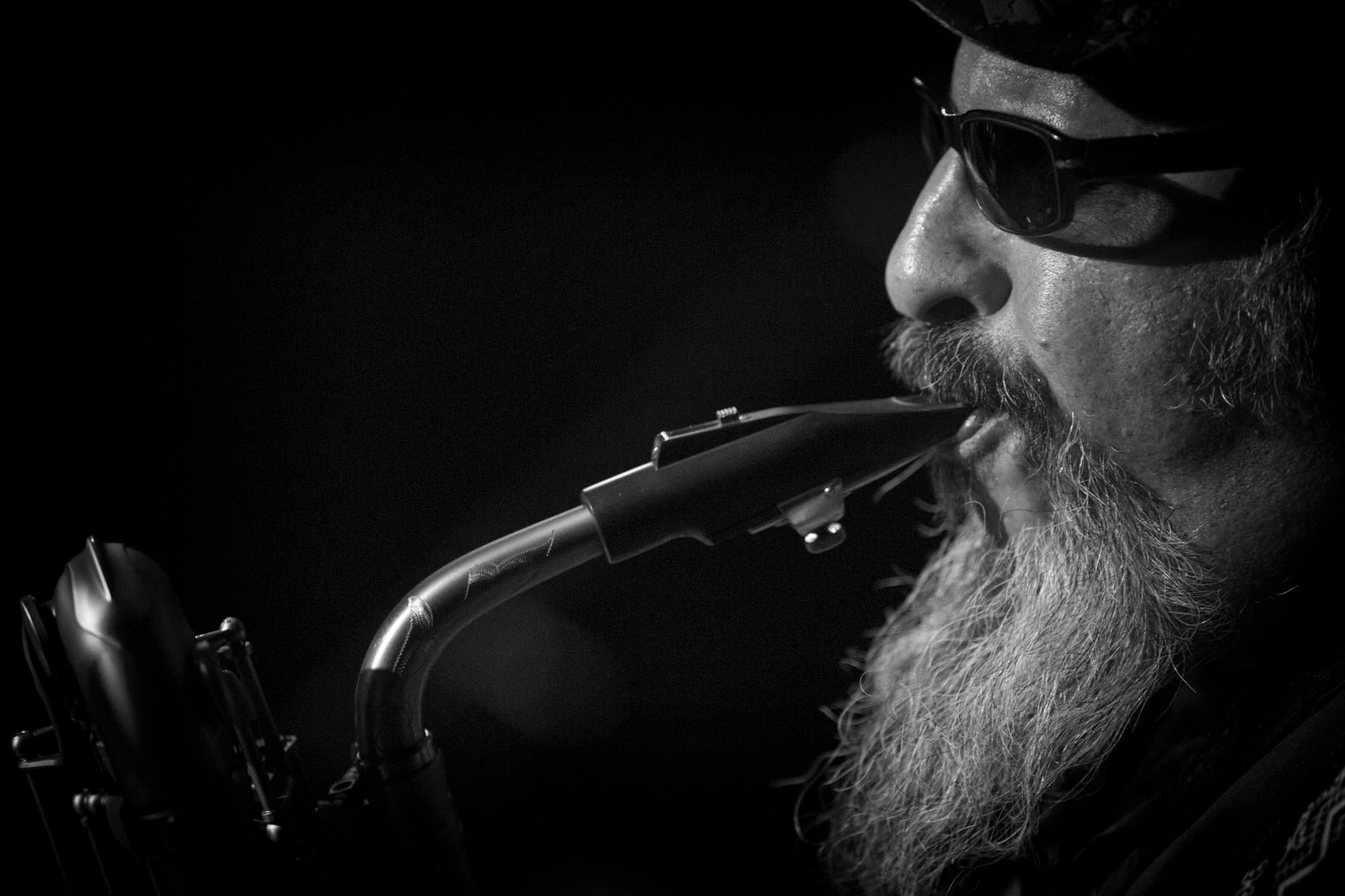 Los Lobos Steve Berlin profile with rmouthpiece b&WSAXOPHONIST